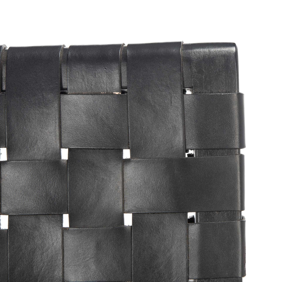 Wide black leather straps form a tightly woven, textured chair back.