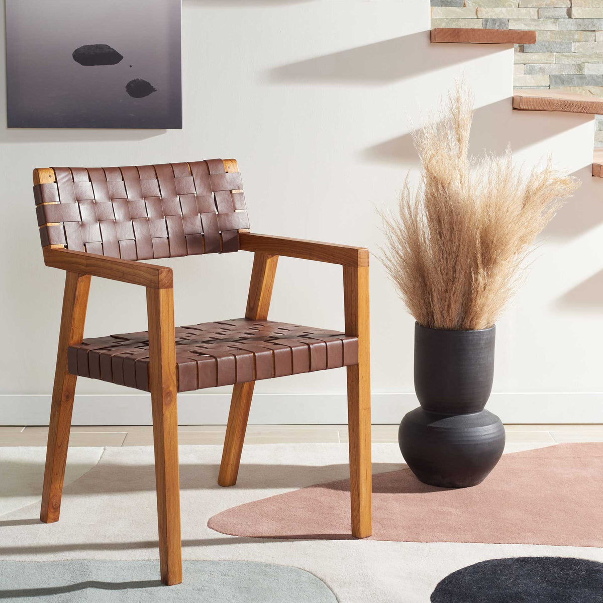 Rich cognac leather and natural wood create a warm, modern dining armchair.