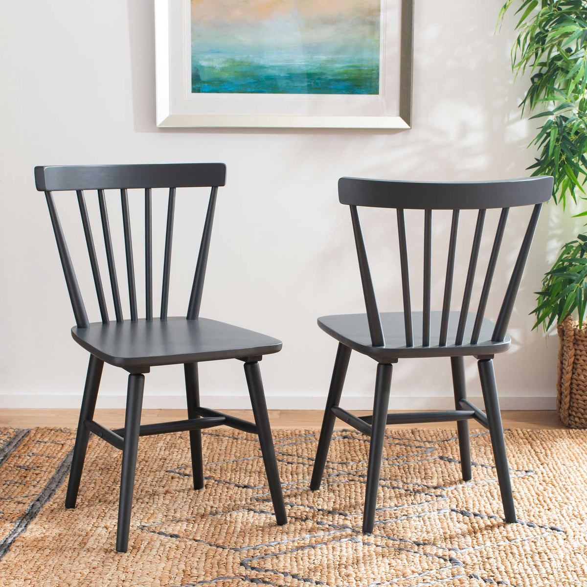 Two gray spindle-back dining chairs bring relaxed farmhouse charm to a bright room
