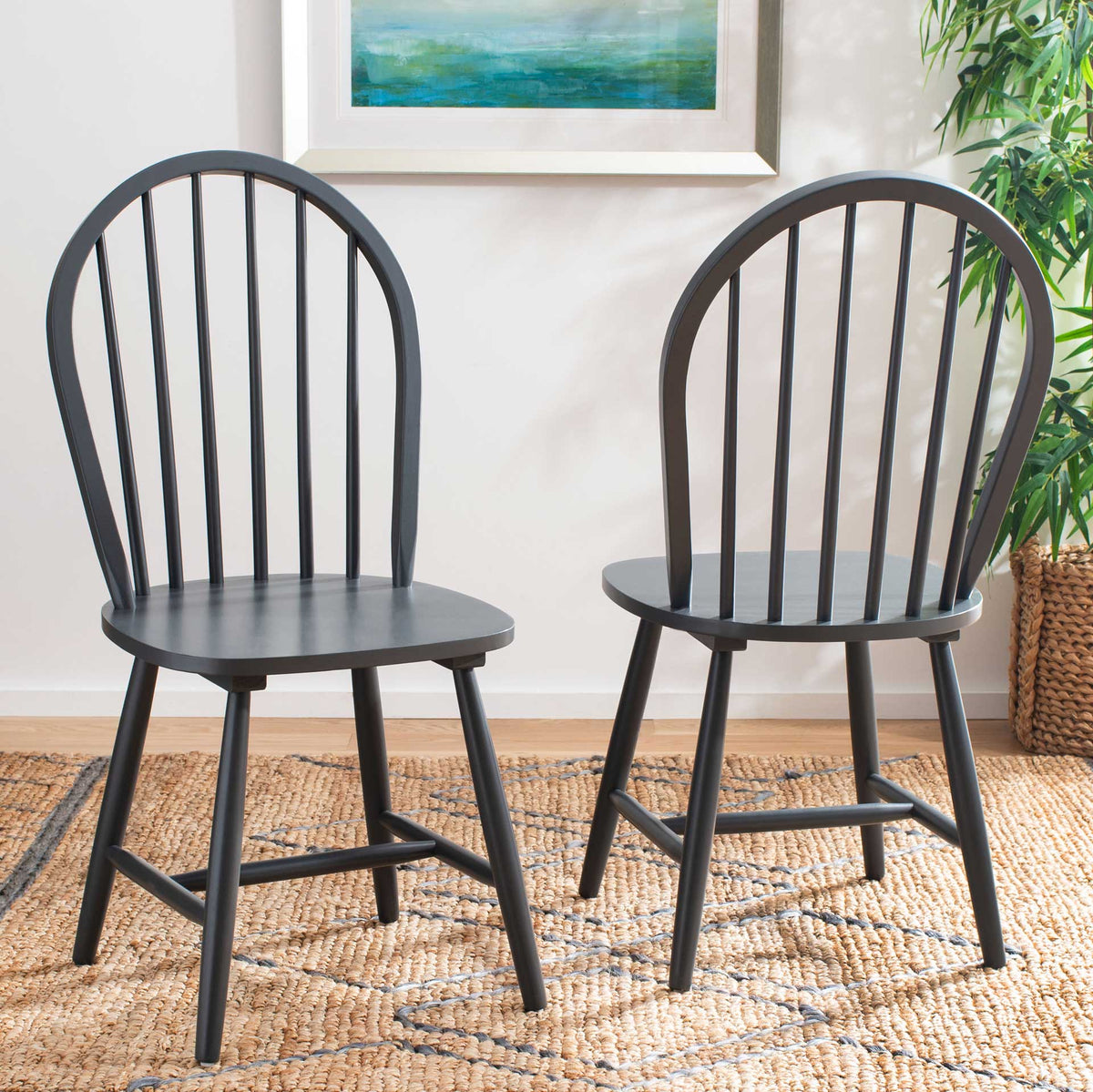 Two gray spindle-back chairs offer a calm finish and gently curved seat edges