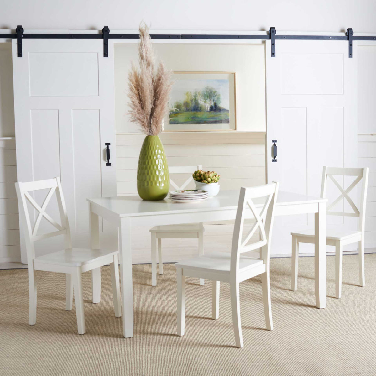White X-back chairs create a bright, coordinated look around the dining table.