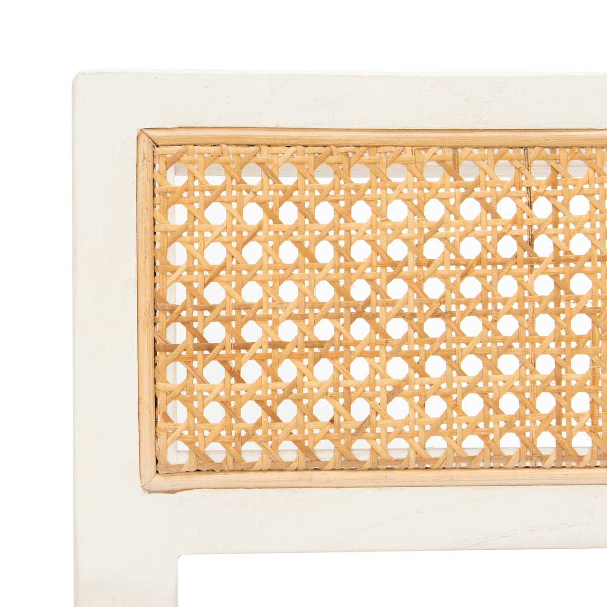 Open woven cane is neatly inset within the dining chair's bright white backrest