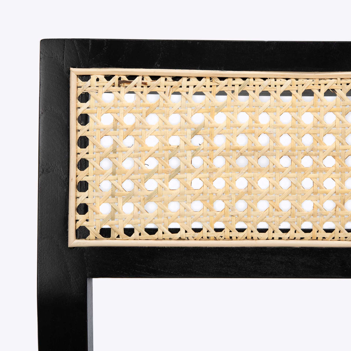 Intricate open cane weave is framed by smooth black-finished elm along the chair back
