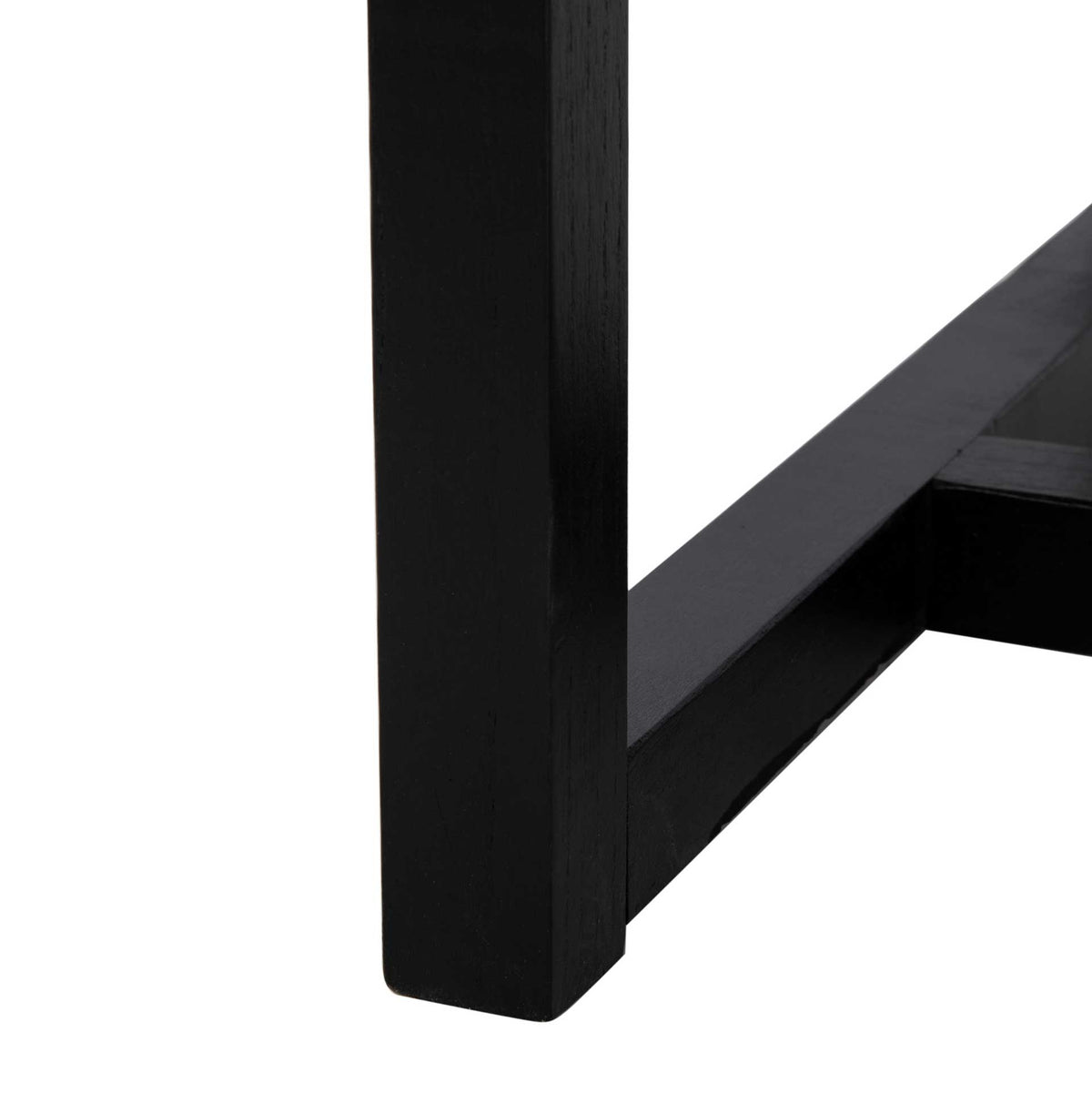 A square black-finished elm leg meets a low support rail for a clean-lined base