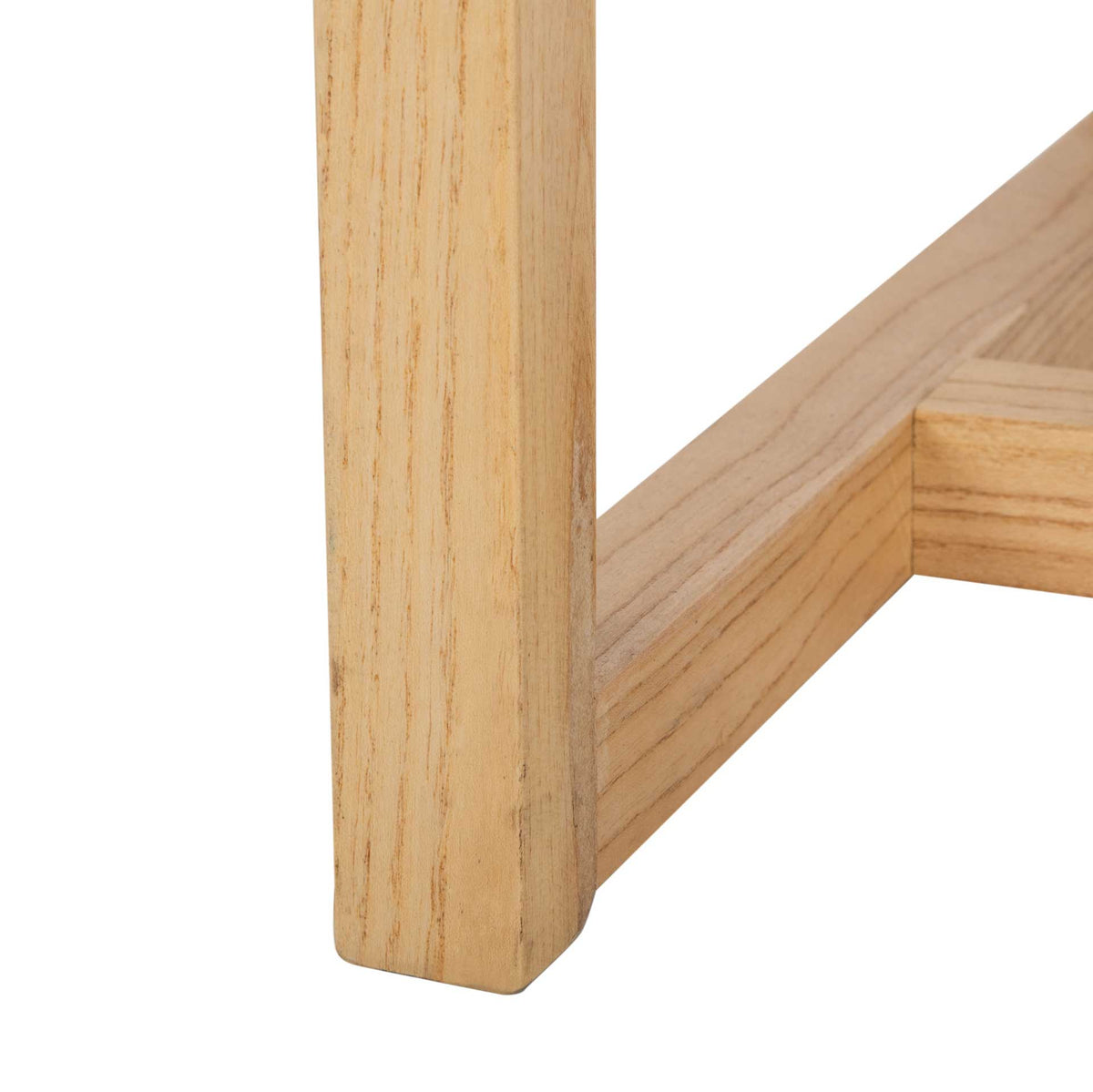 A straight natural elm leg connects to a low base rail, revealing the wood's flowing grain