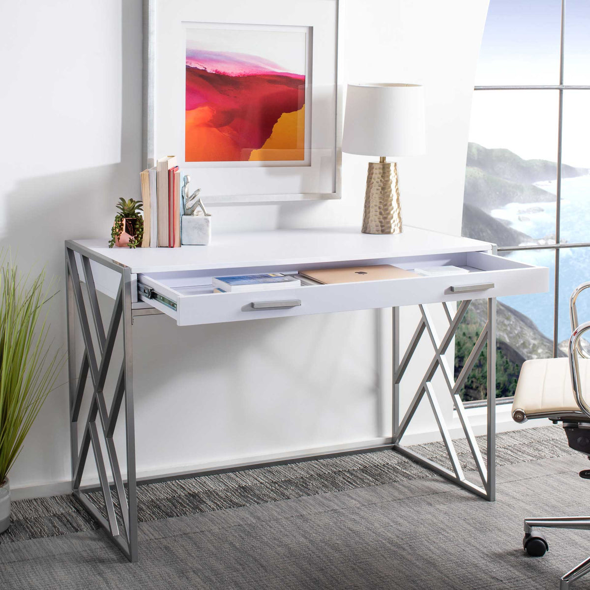 An open white drawer keeps papers and supplies organized beneath the clean desktop.