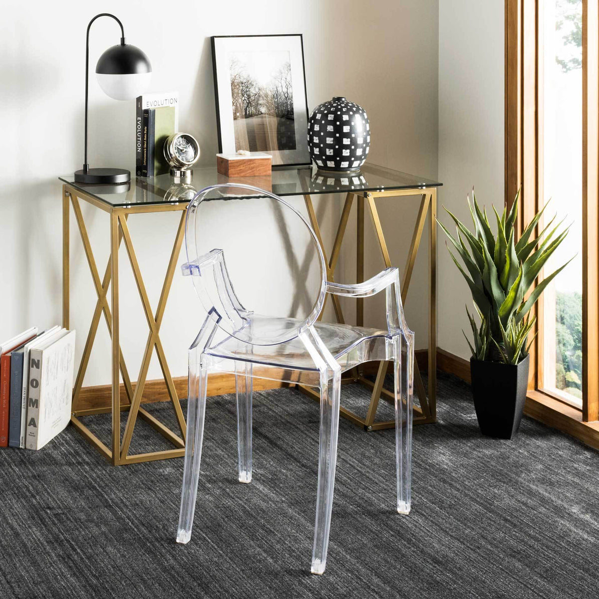 Clear glass and gold X-braced legs bring light, elegant style to a home workspace.