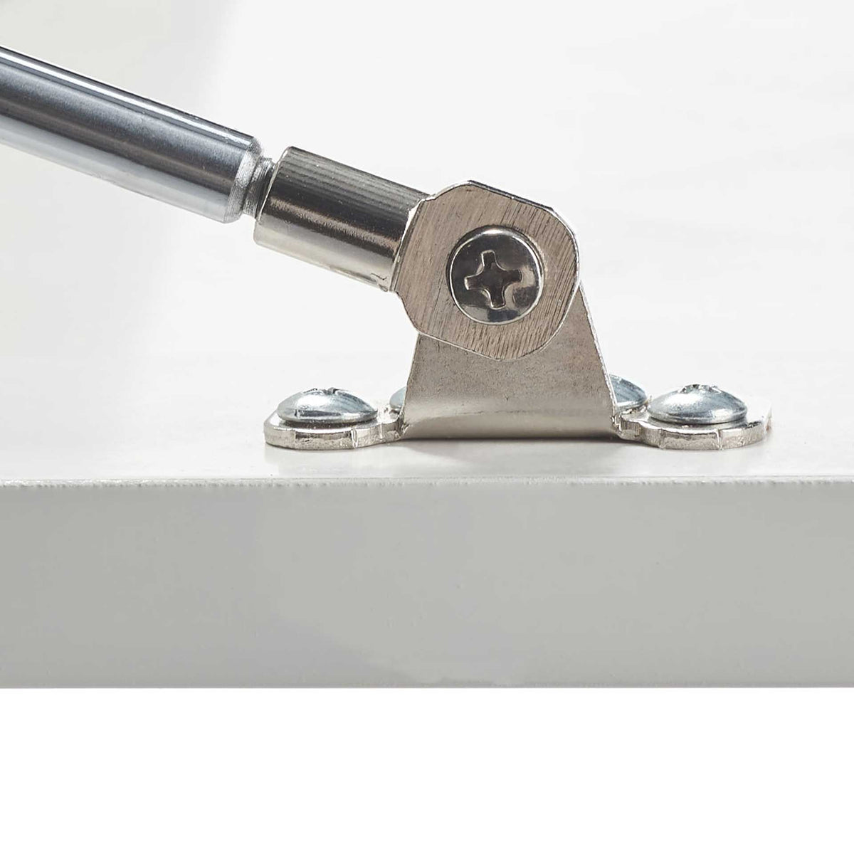 A silver hinge and support strut connect to the crisp white fold-down panel.