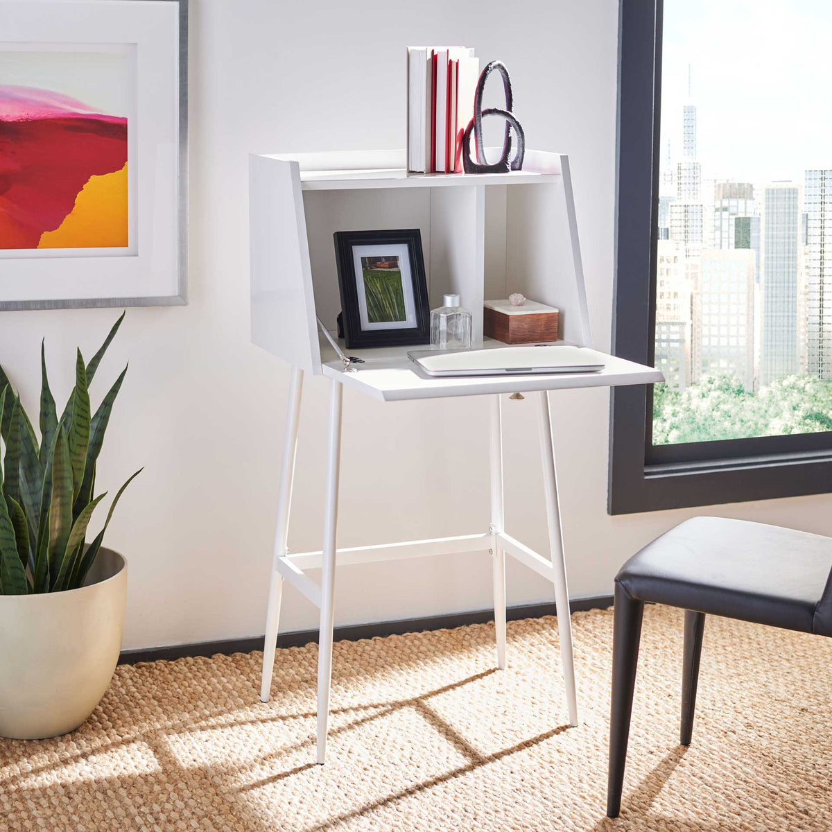 A white fold-down desktop opens onto two cubbies with room for books and desk accessories.