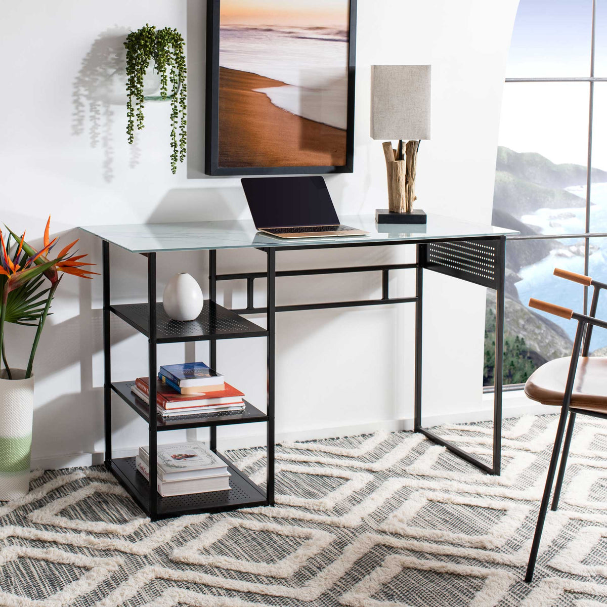 A white glass work surface and open black metal shelves make room for books, decor, and daily tasks.