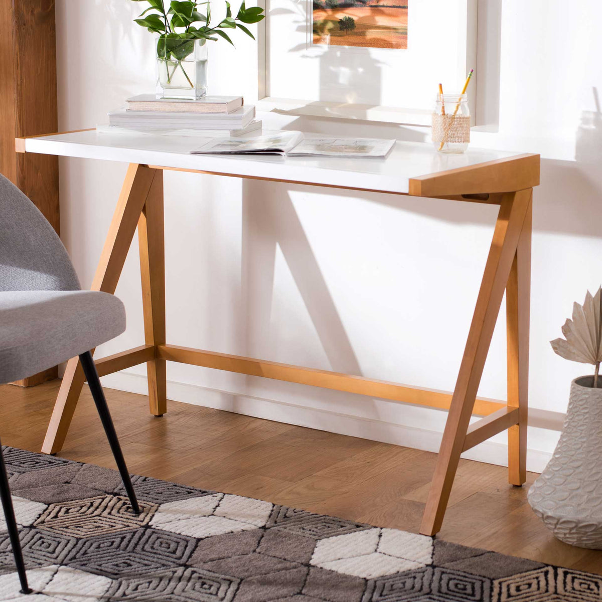 A white top and oak-toned legs lend a bright, uncluttered feel to the home workspace.