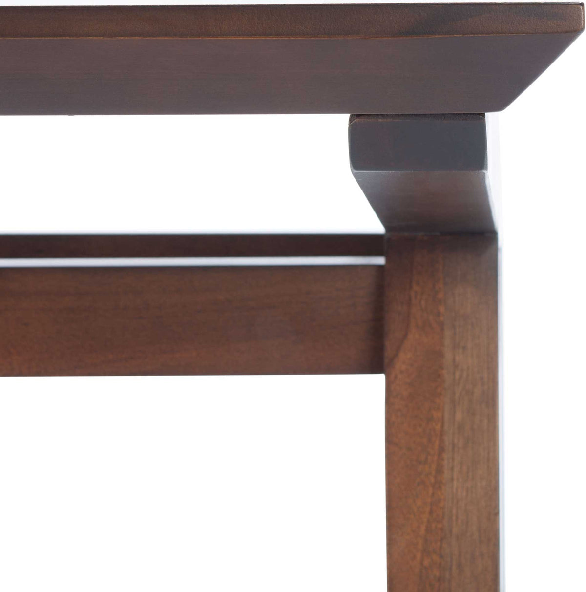 A rich walnut finish highlights the fitted joinery of the desktop, leg, and support rail.
