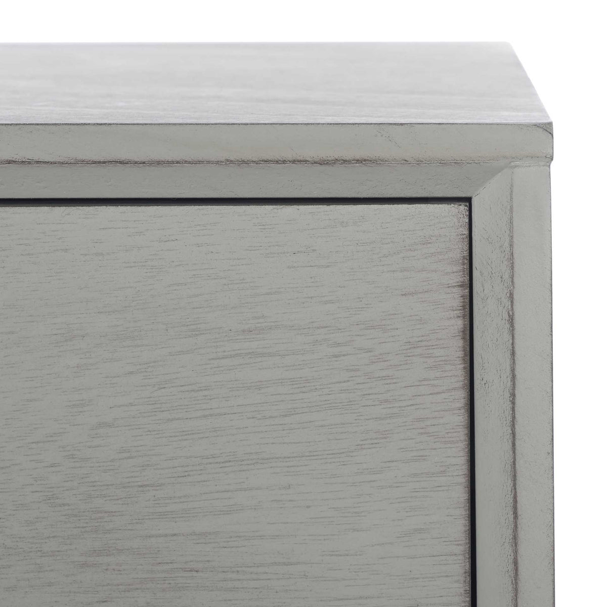 Dark rubbed edges accent the distressed gray grain and framed drawer front
