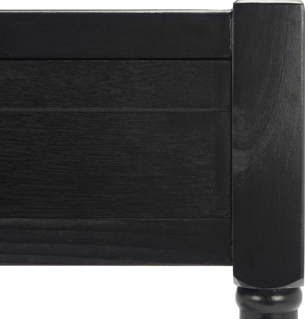 Subtle wood grain and a substantial corner post enrich the black desk's framed drawer front