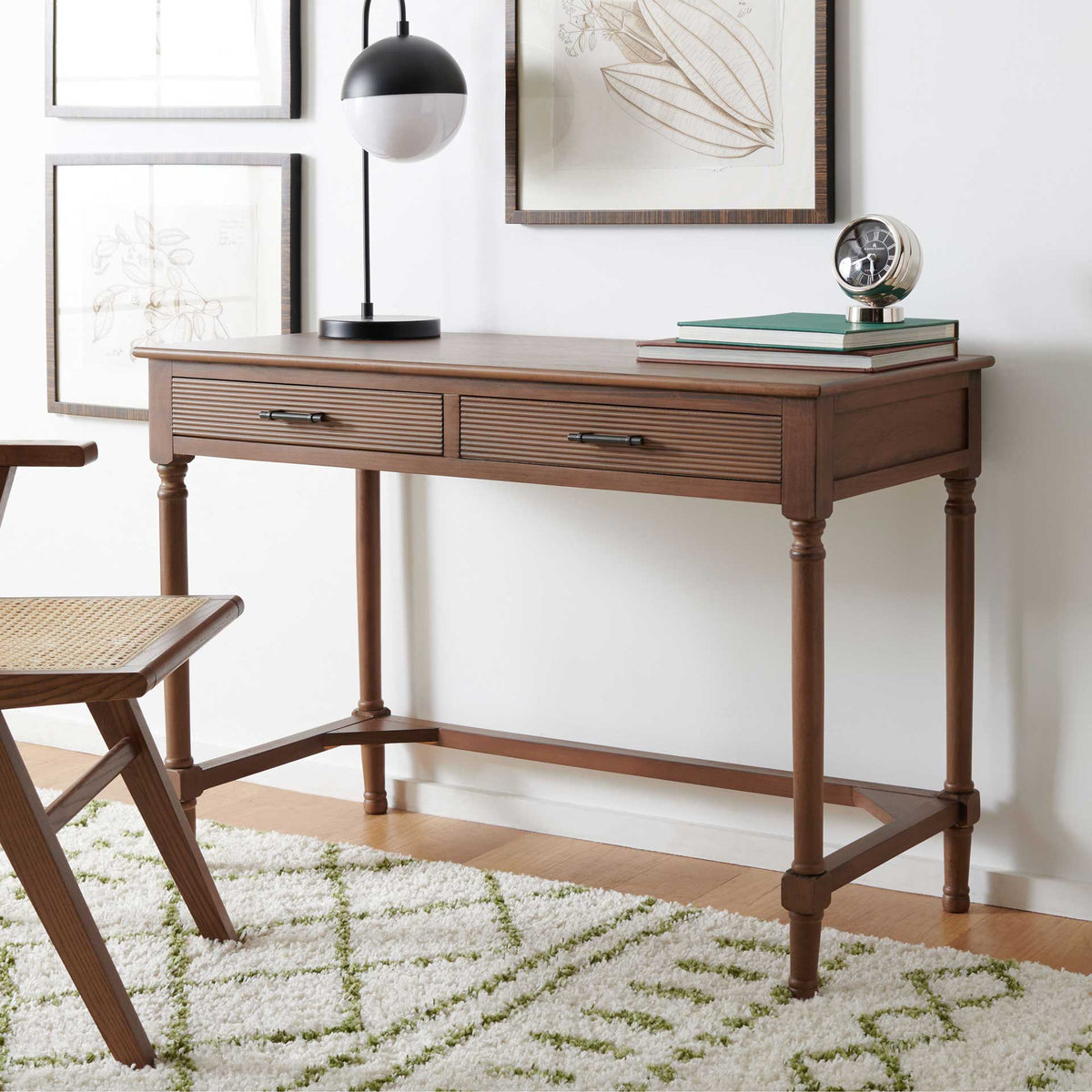 A warm brown finish and slim proportions make this two-drawer desk a natural fit for a cozy workspace