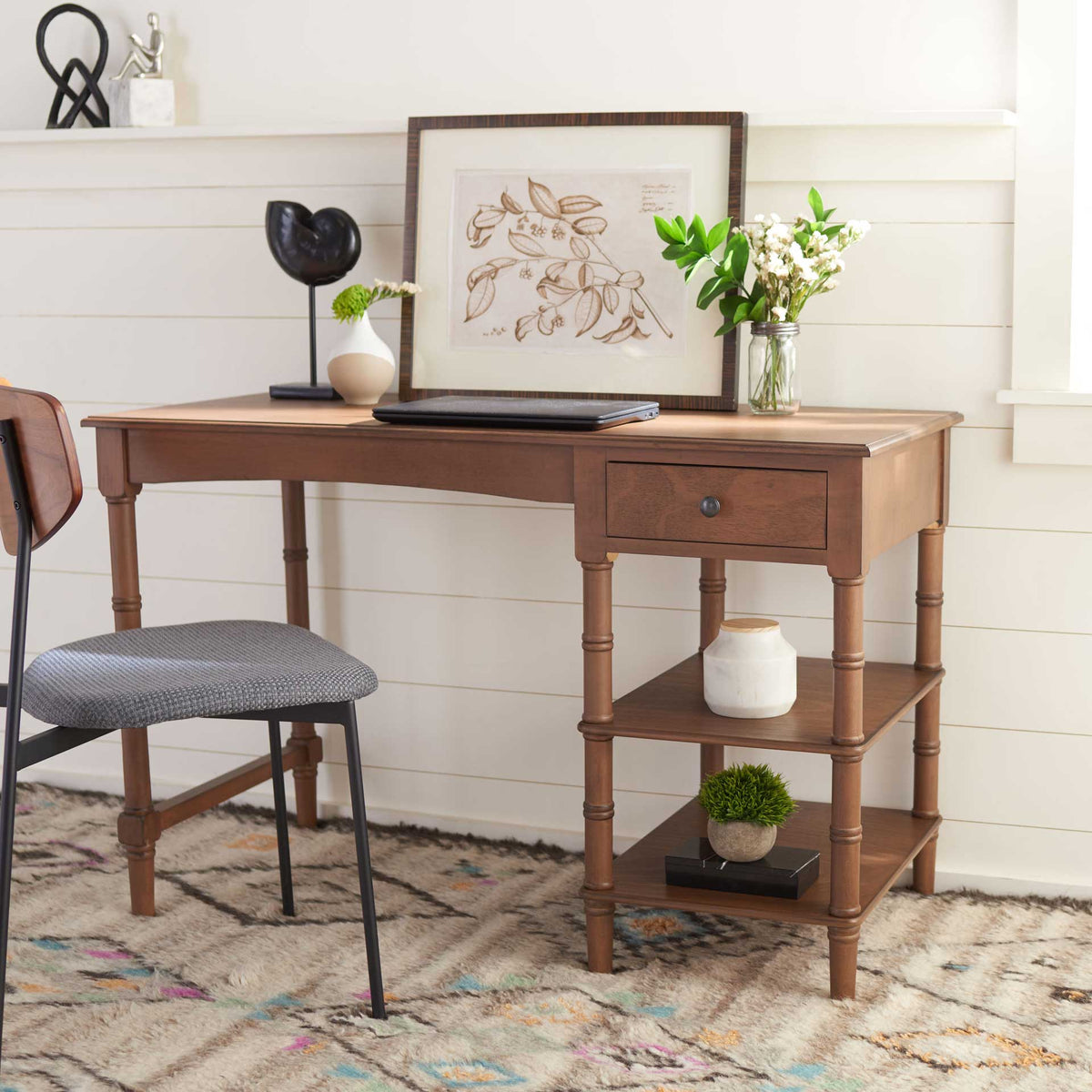 This warm brown desk adds a convenient drawer and two open shelves to a cozy workspace.