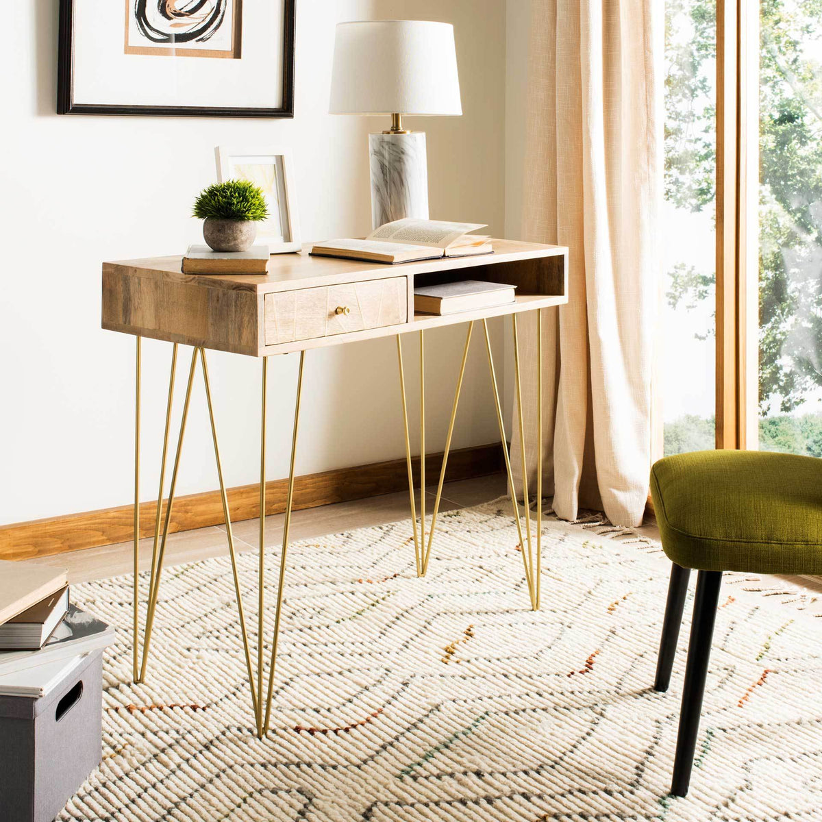 Natural wood, a patterned drawer, and brass-tone legs bring a bright, retro touch to a workspace