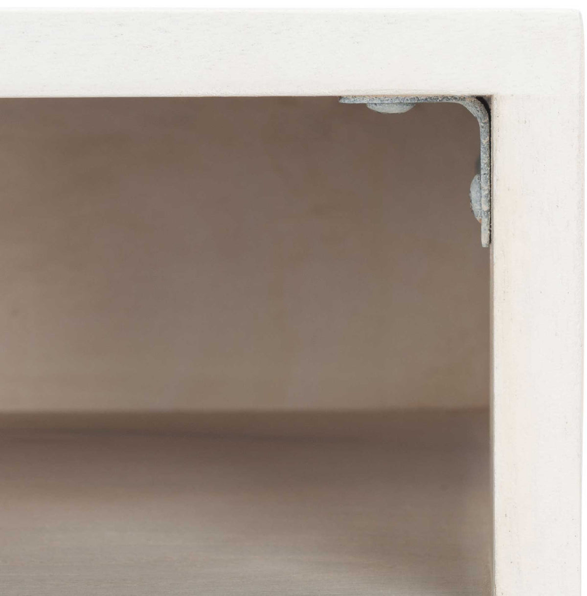 Warm wood grain inside the open shelf contrasts with its smooth whitewashed frame