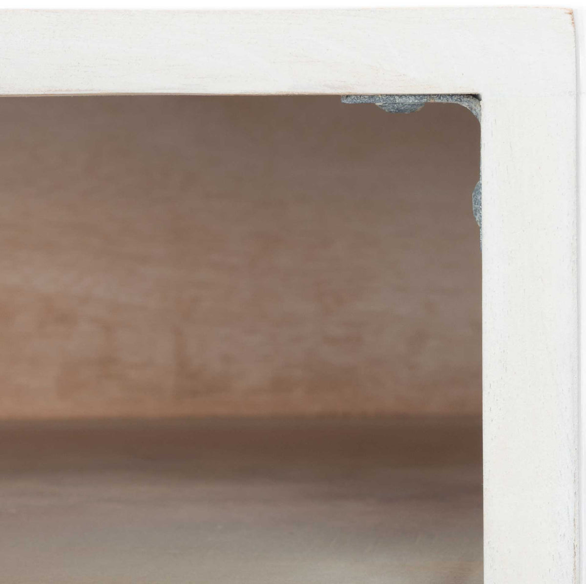 The open cubby reveals warm wood grain framed by a crisp whitewashed finish