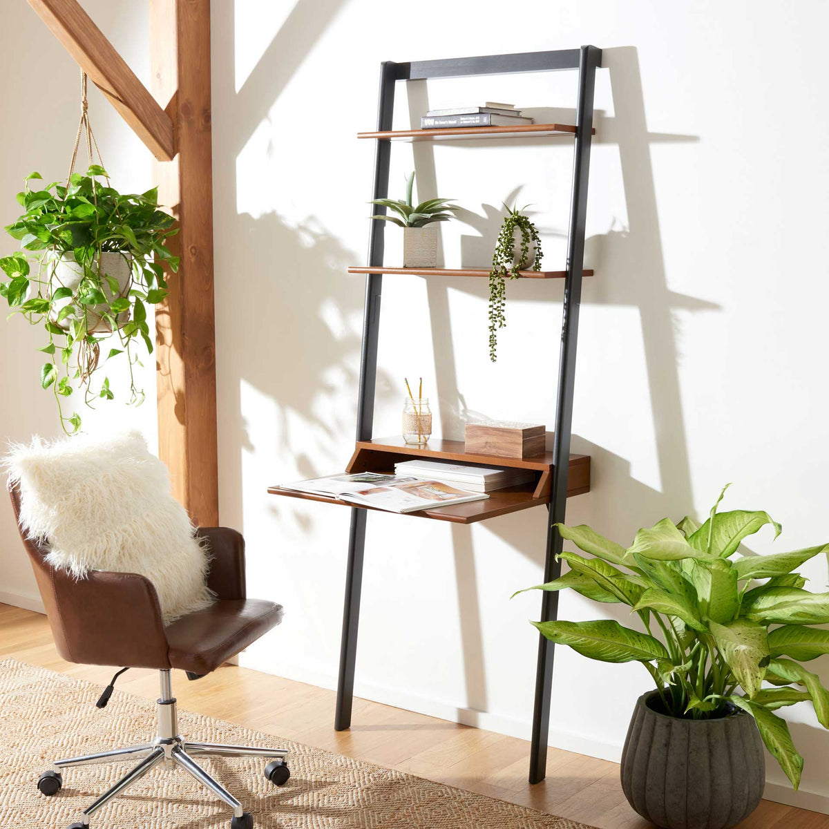 A honey-brown desktop holds reading materials beneath open shelves filled with greenery.