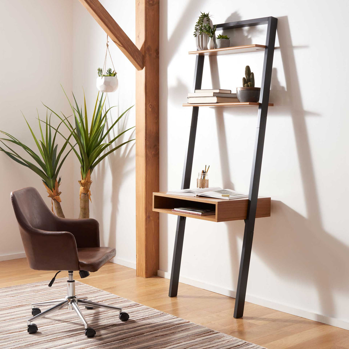 A leaning desk brings a compact workspace and display shelves to a bright home office.