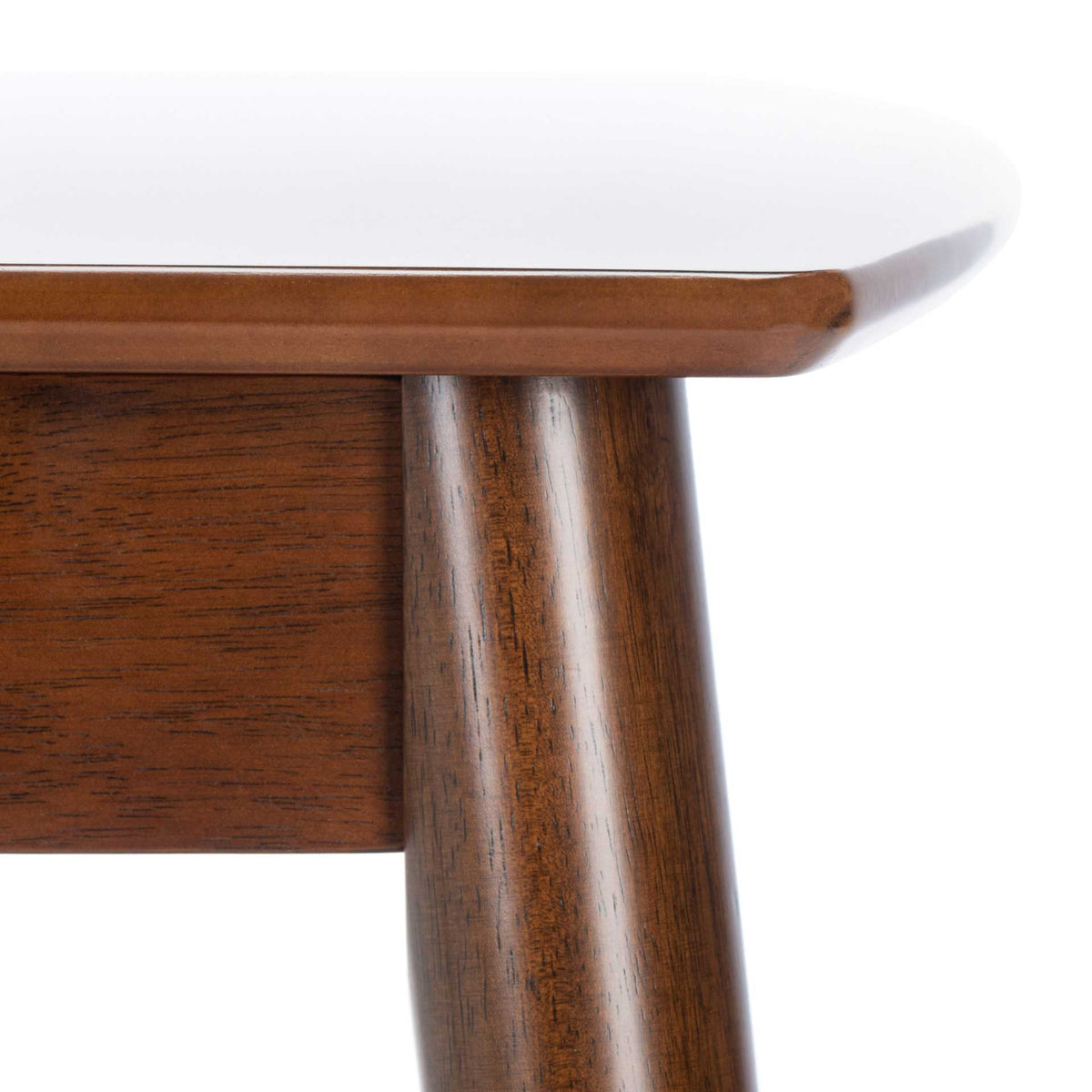 Wood grain highlights a tapered leg beneath the tabletop's gently rounded edge.