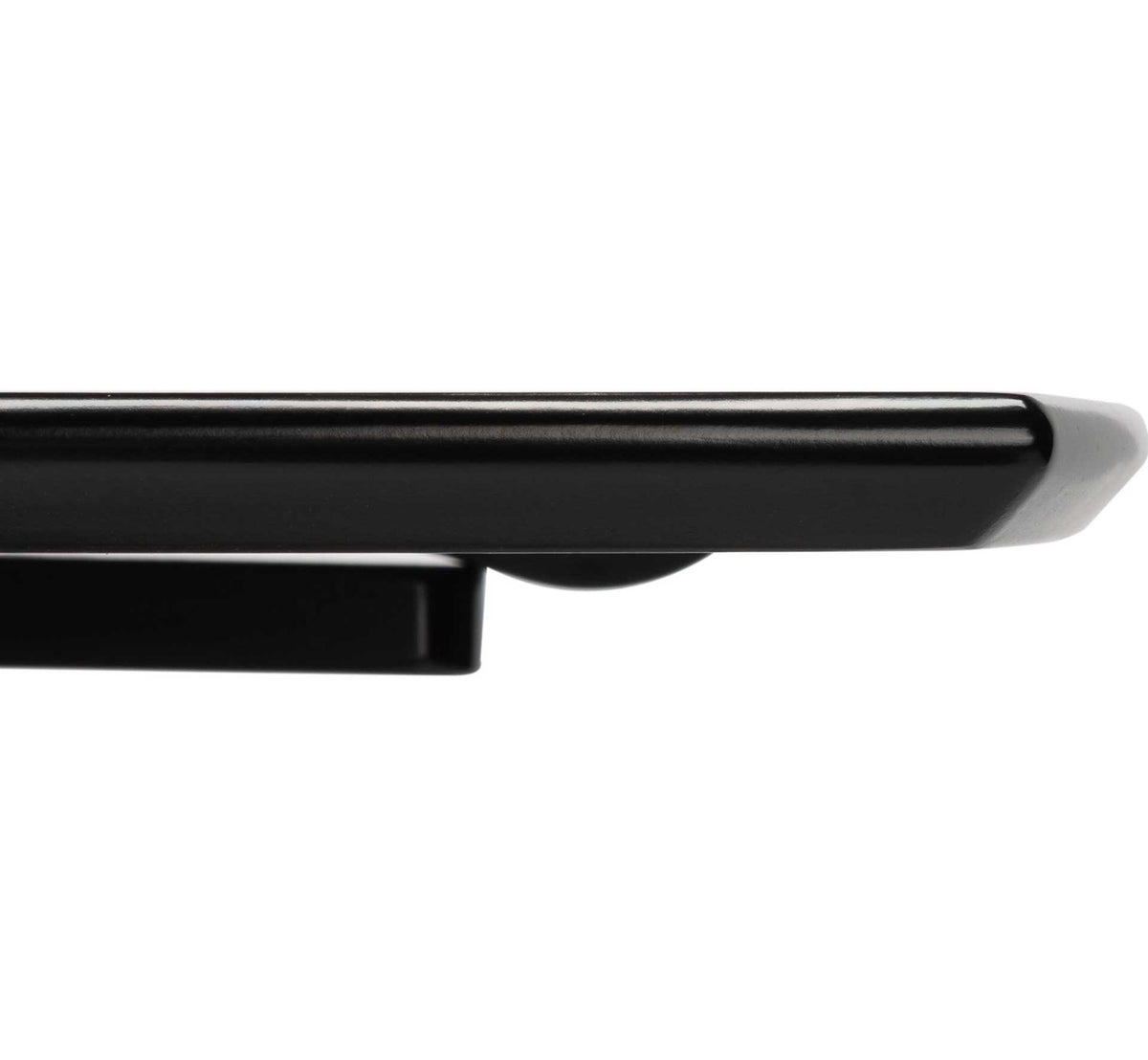 The matte black tabletop has a smoothly rounded edge and a clean, refined finish