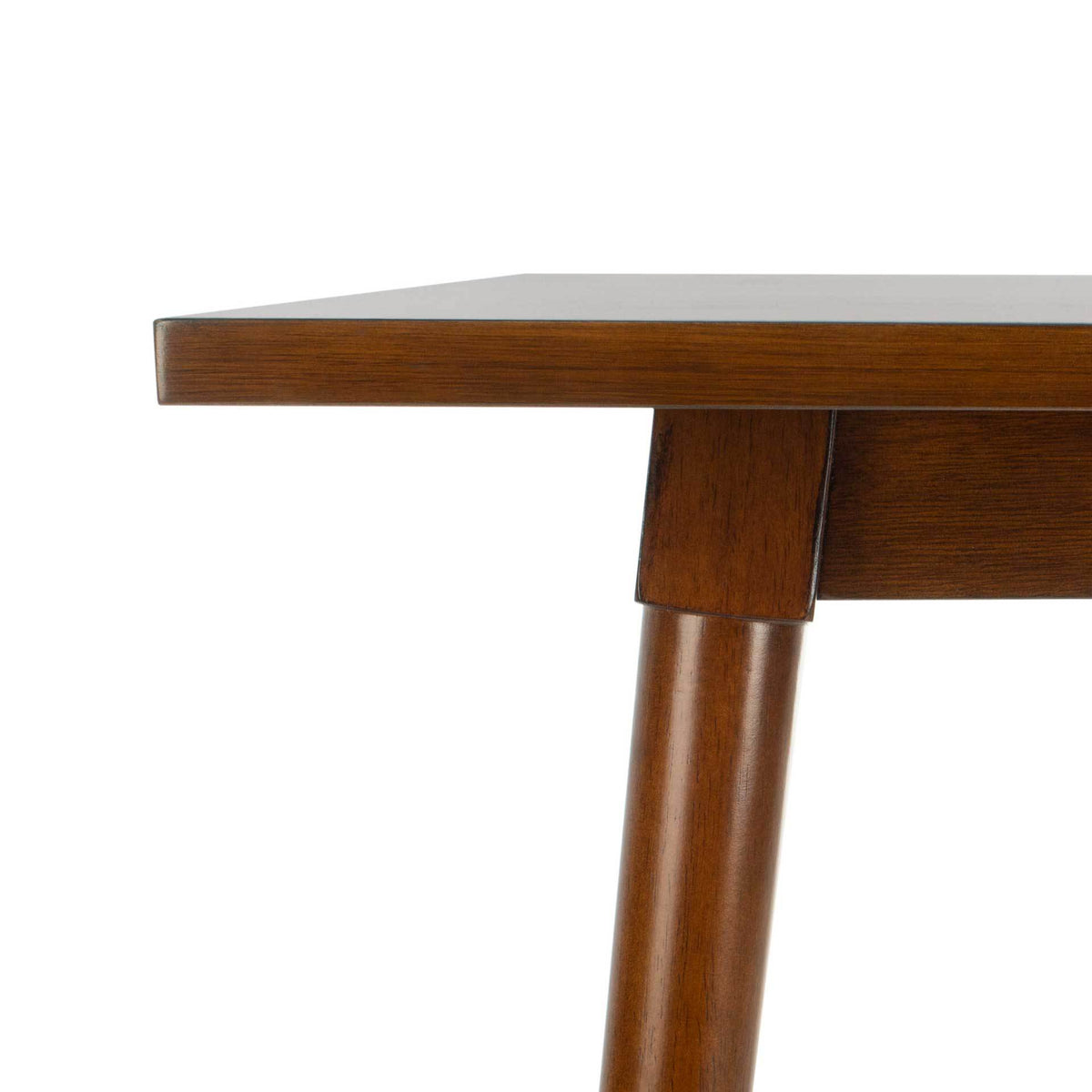 Rich walnut grain accents the slim tabletop edge and angled leg joint.