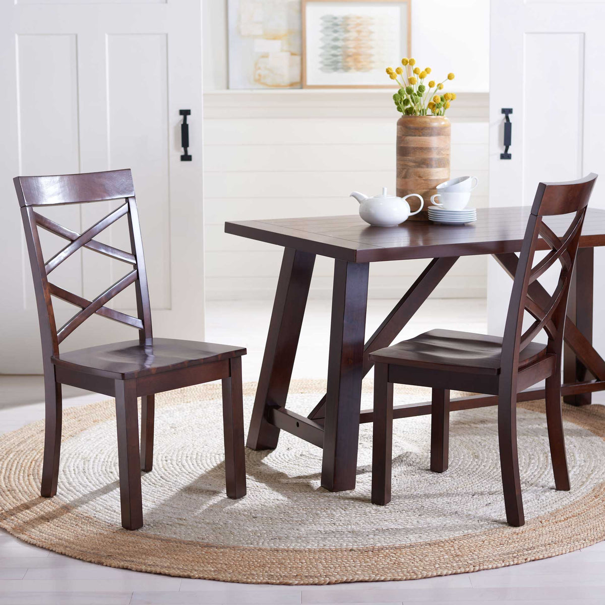 The warm brown dining table pairs with X-back chairs for an inviting place to gather.