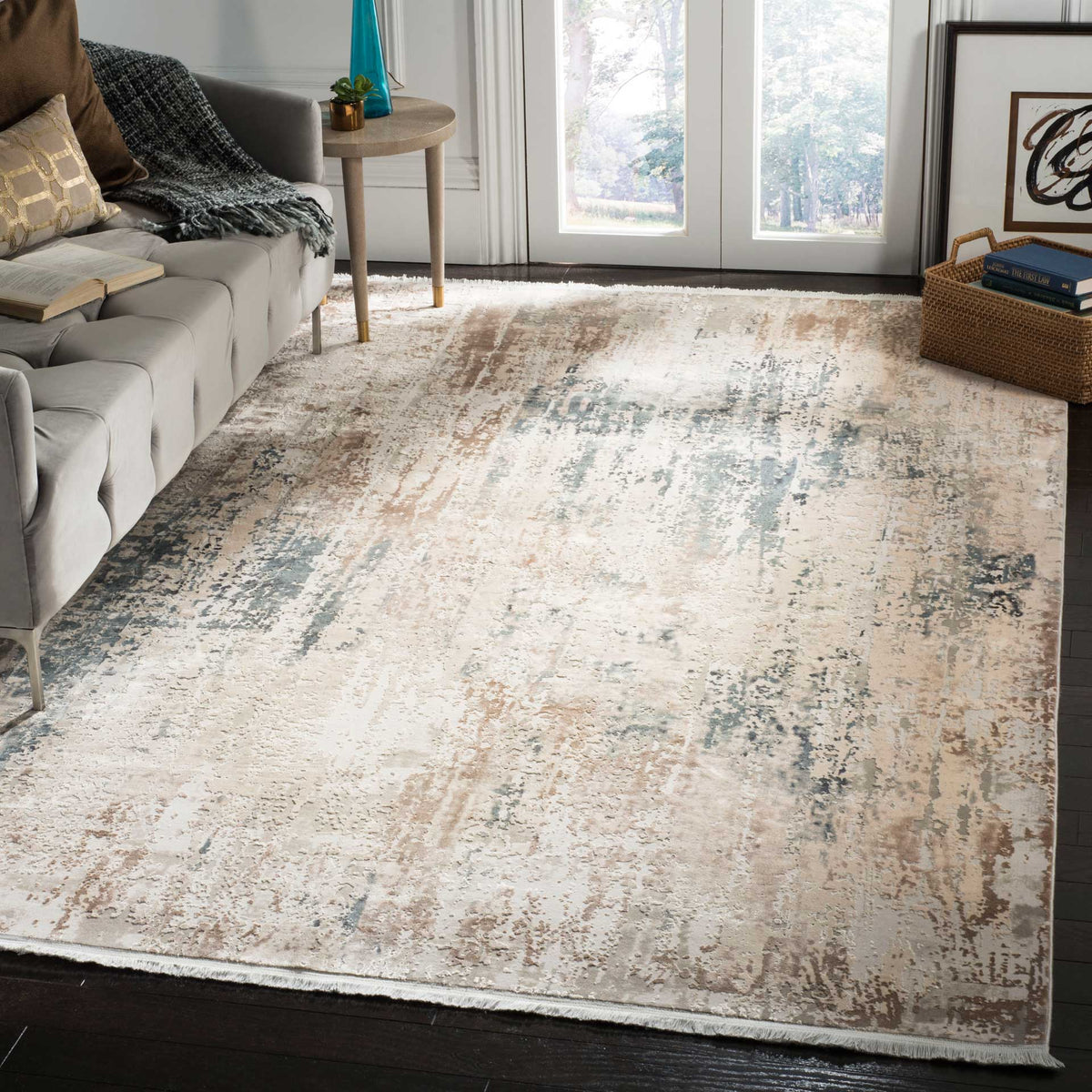 Beige and gray abstract rug with hints of blue brings warmth to a modern living room