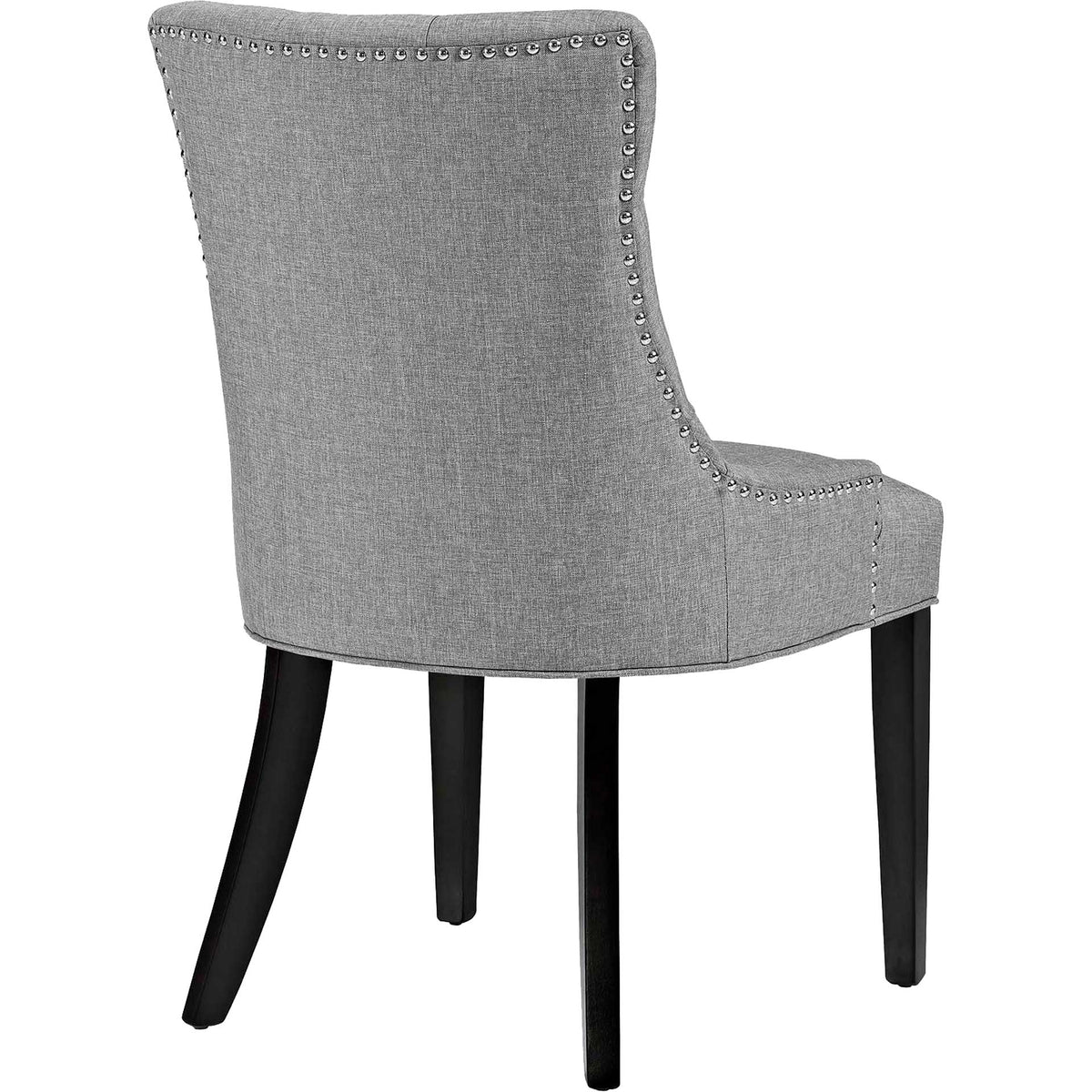 Tailored light gray fabric and metallic nailheads accent the chair back above dark tapered legs.