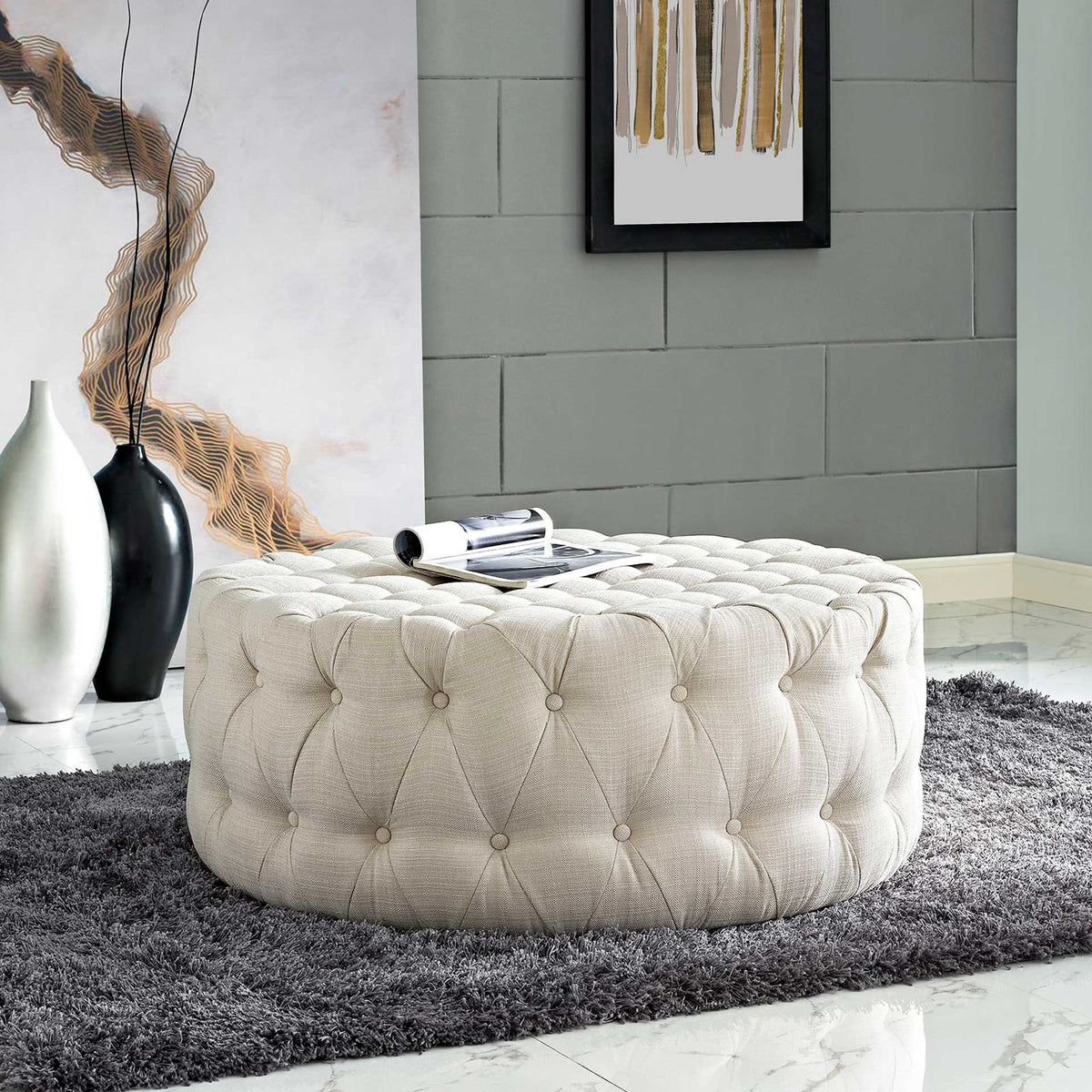 Button-tufted beige ottoman brings inviting softness to a modern living space
