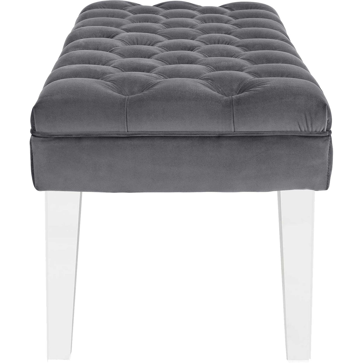 Soft gray velvet upholstery highlights the bench's thick tufted cushion and clear legs