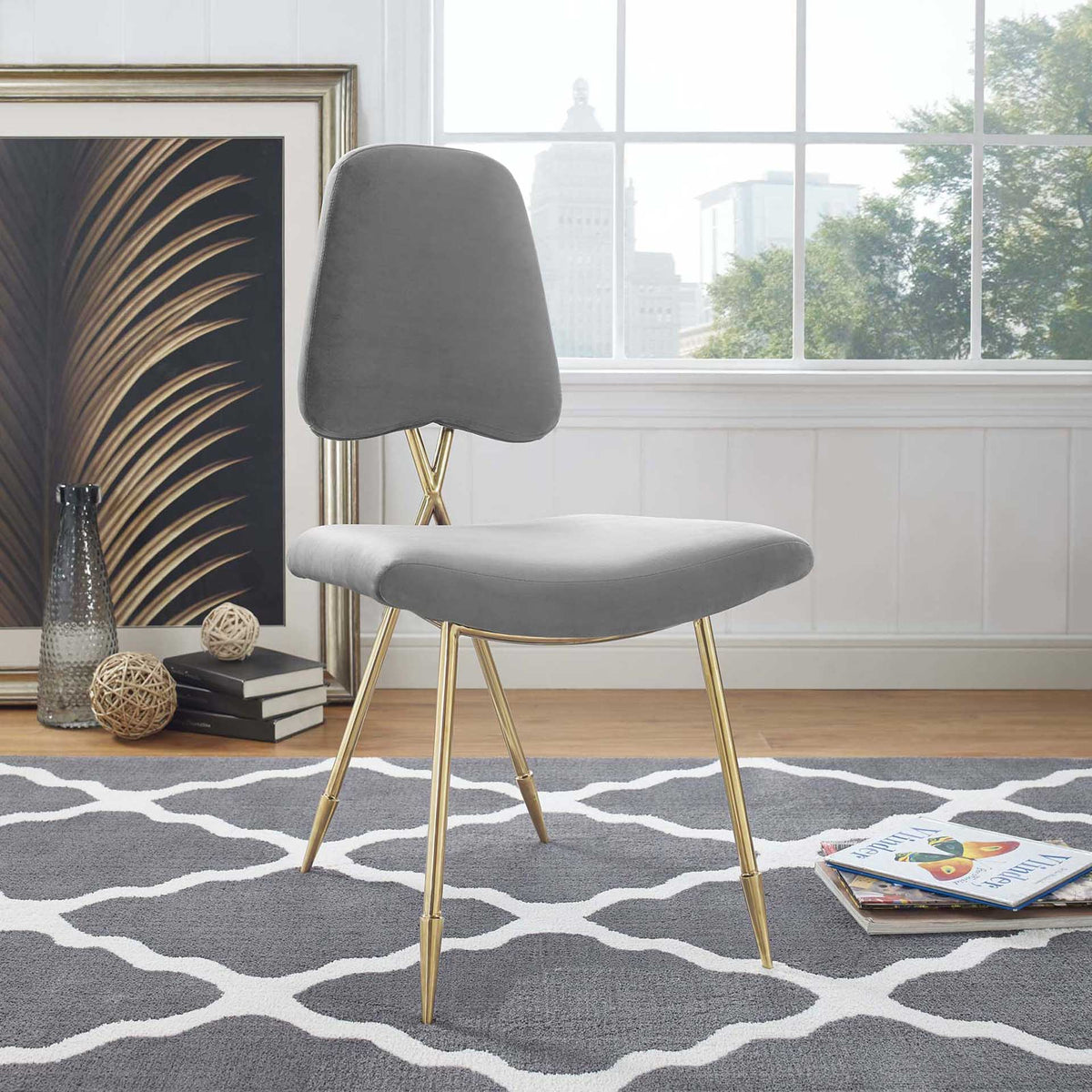 Plush gray velvet and slender gold legs give this chair an airy, modern look
