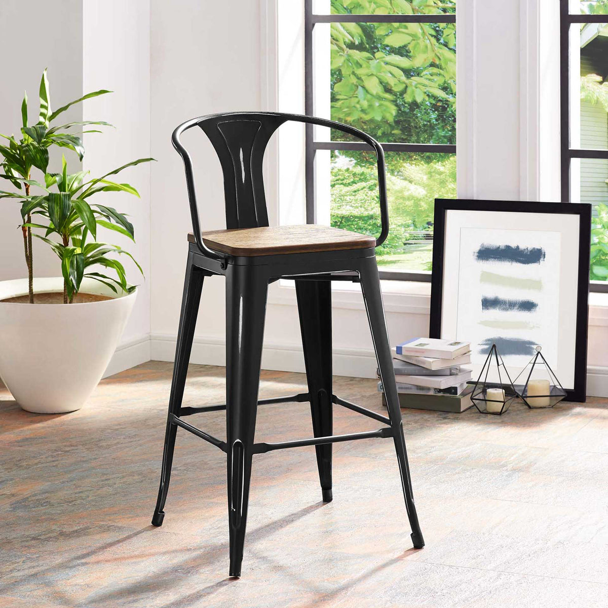 Black steel bar stool with a bamboo seat brings bistro charm to a bright room