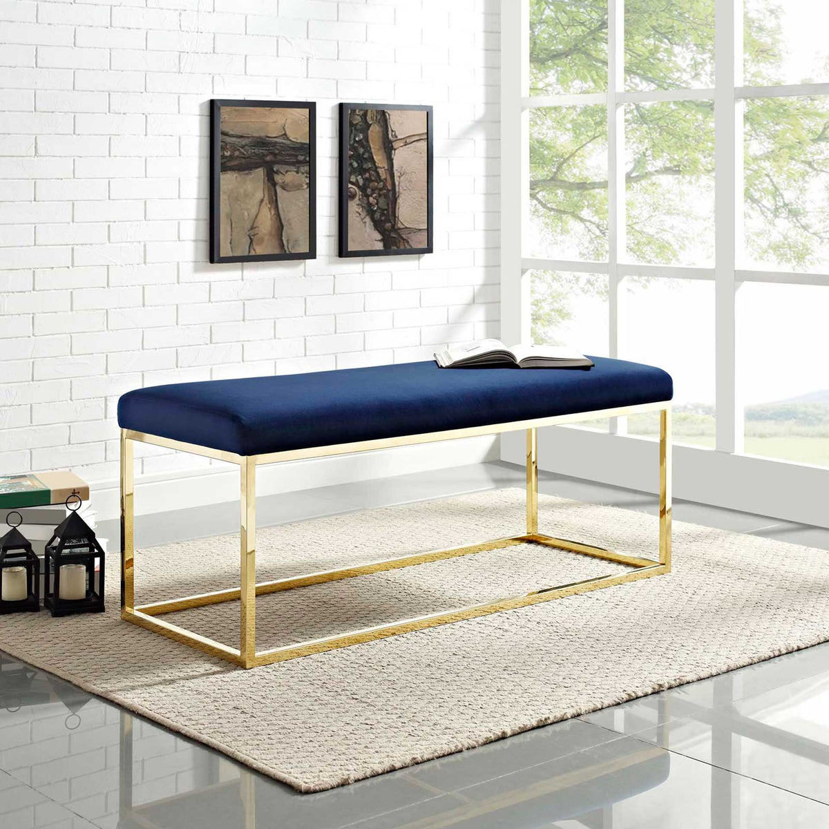 A navy cushioned bench pairs soft texture with a bright gold frame