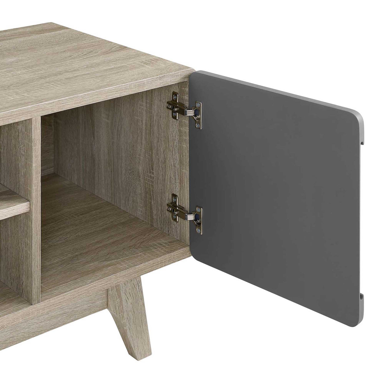 An open gray cabinet door reveals concealed storage and metal hinges in the wood-grain console.