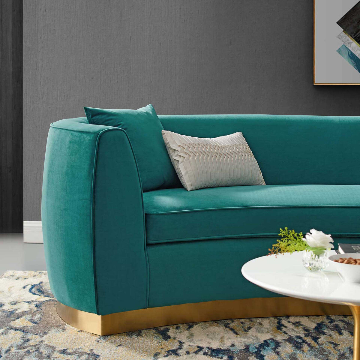 A plush teal velvet seat and rounded arm meet a shimmering gold base for a luxe finish