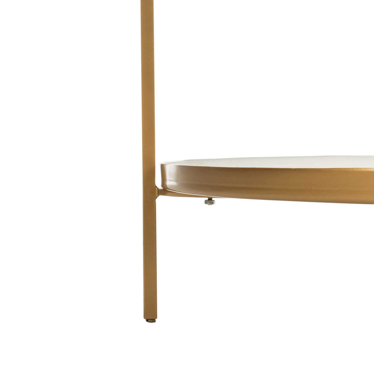 A slender brass-finished leg supports a white shelf edged in warm metallic trim.
