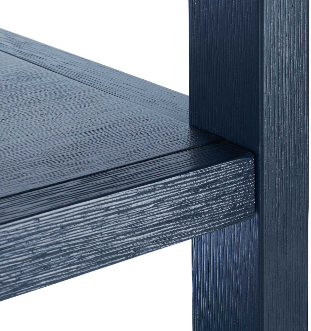 A textured navy wood-grain finish adds depth to the shelf edge and square support post.