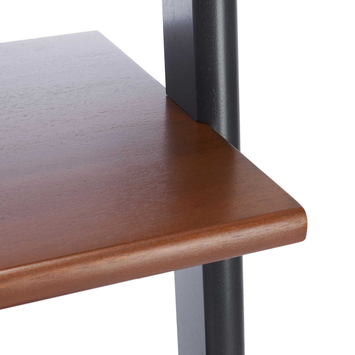 A smooth honey-brown shelf features a rounded edge and a contrasting charcoal support
