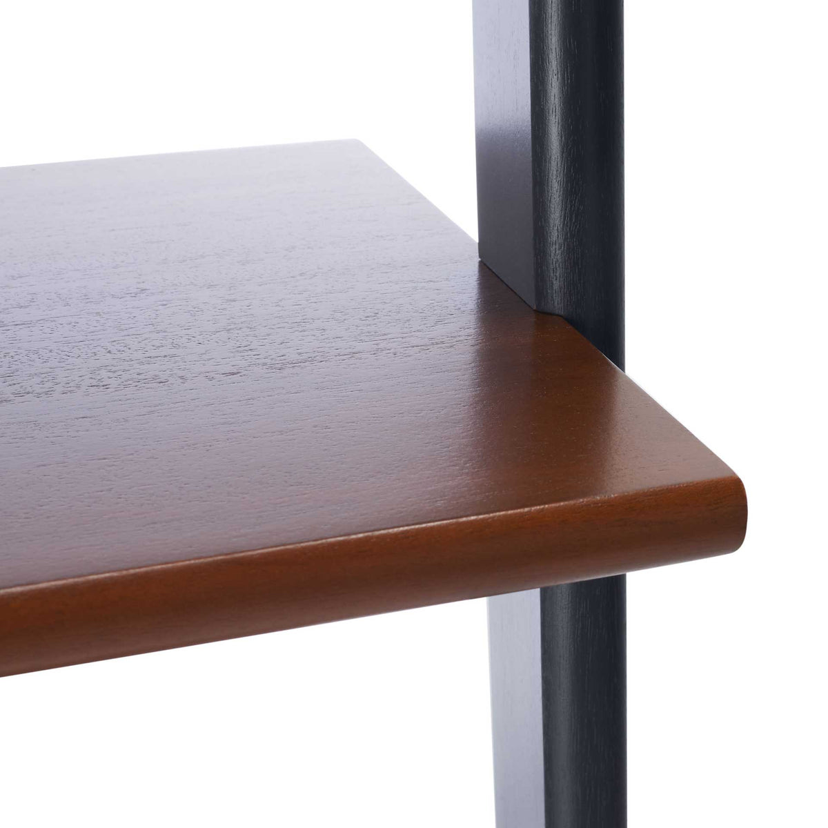 A rounded honey-brown shelf edge meets a sleek charcoal upright.