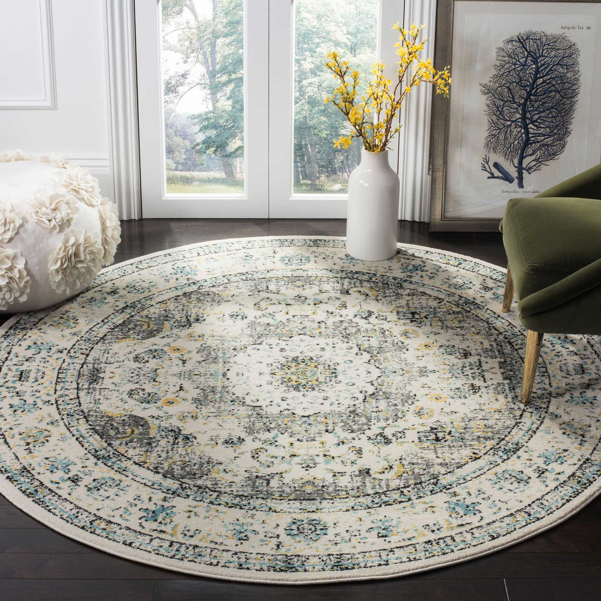 Muted gray and gold floral motifs bring vintage-inspired character to this round medallion rug.