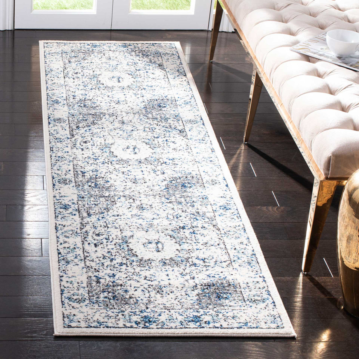A long ivory runner brings faded blue-gray florals to narrow spaces
