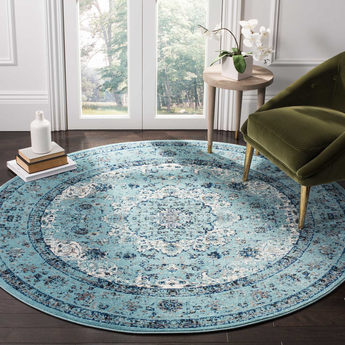 Light blue and navy medallion motifs lend an inviting patterned finish to this round rug.