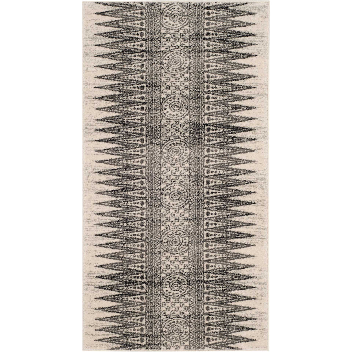 Compact ivory and gray accent rug pairs a medallion stripe with dense, pointed geometric borders.