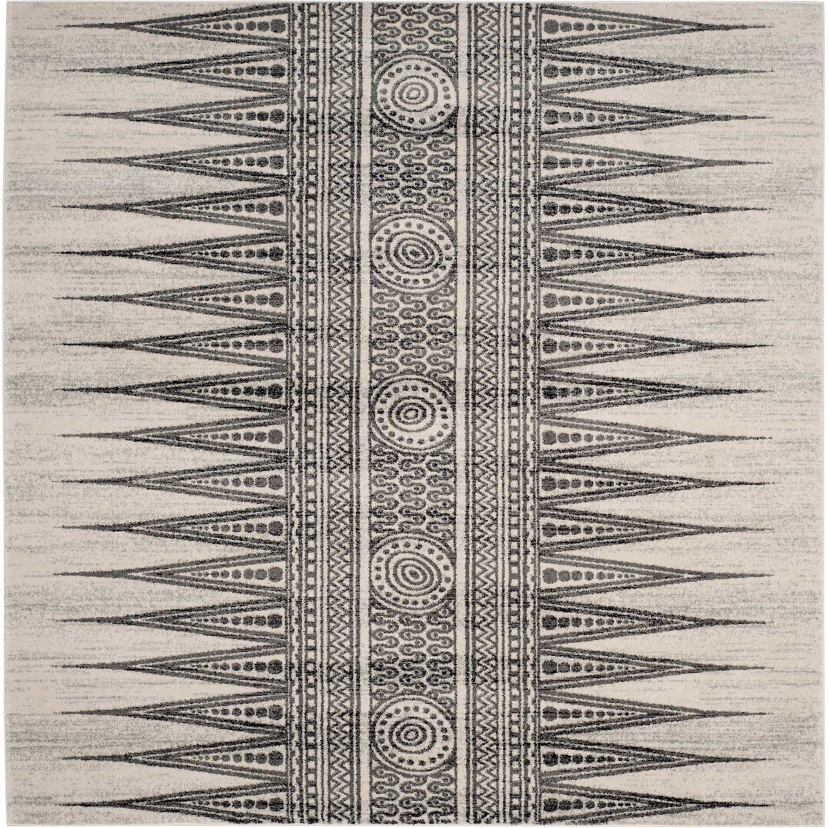 Ivory and gray area rug with a central row of circular medallions flanked by bold geometric zigzags. || EVK226D-8 || top_studio