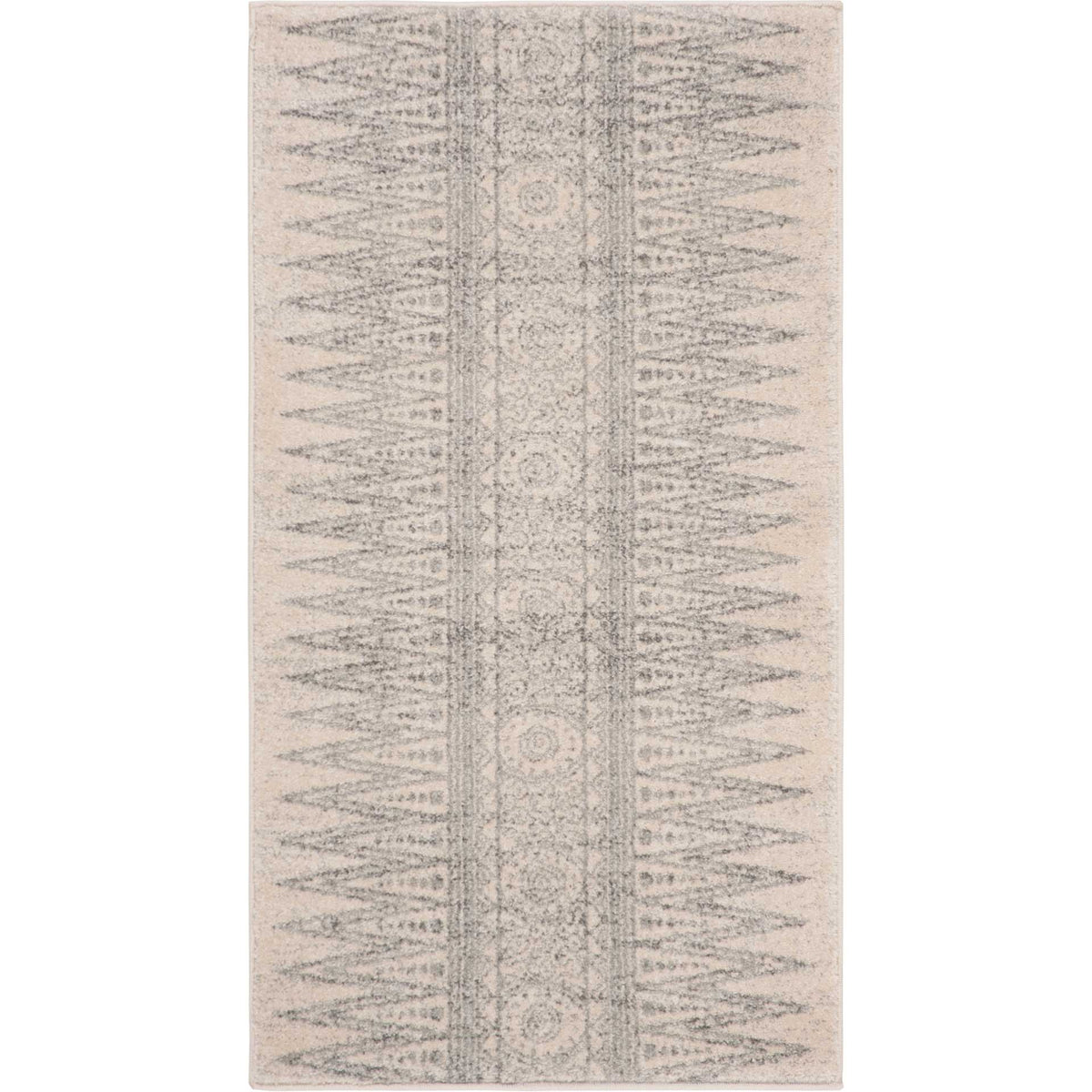 Small ivory and silver accent rug blends faded medallions with tapered side motifs.
