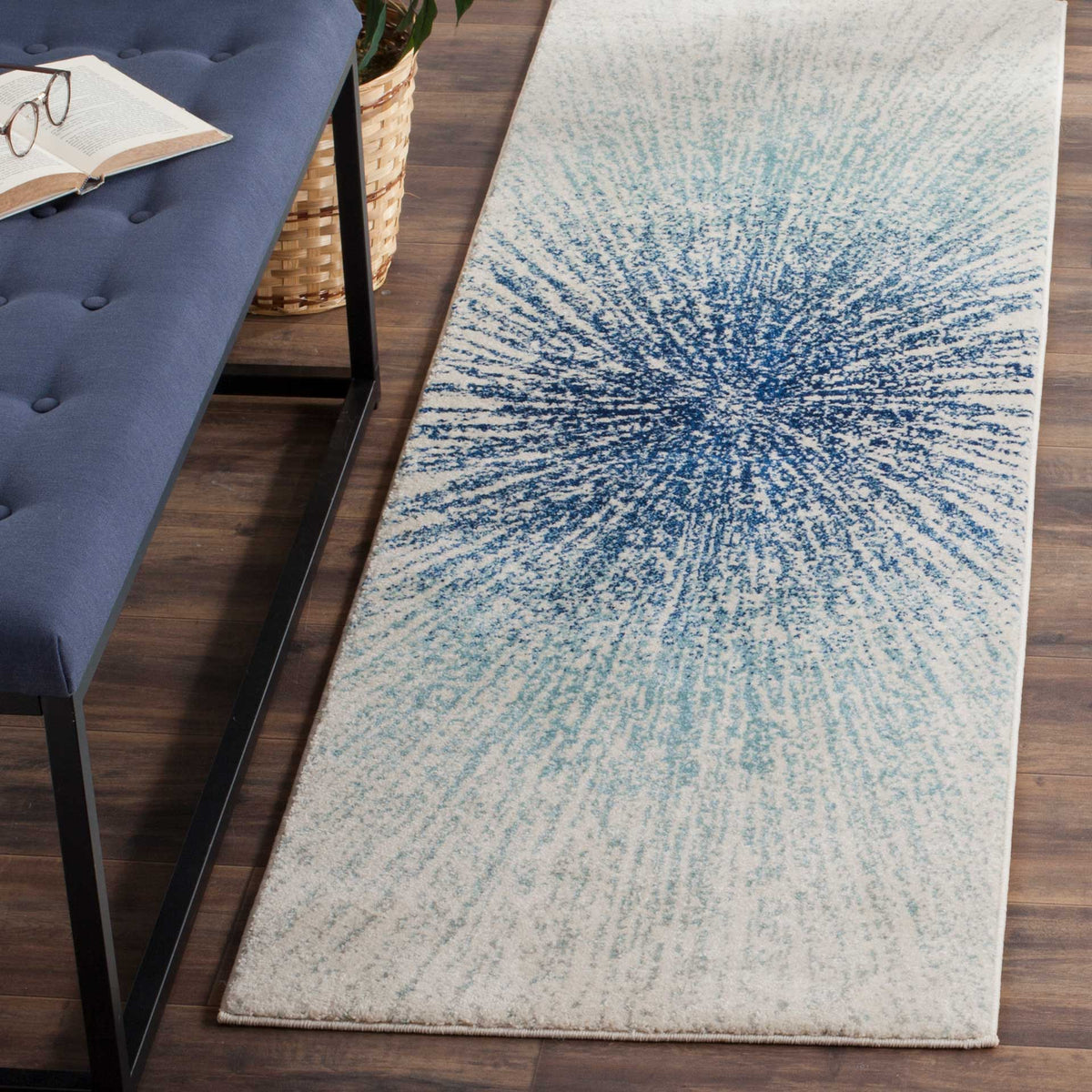 Deep royal blue rays sweep across this ivory runner for a bright, dynamic accent.