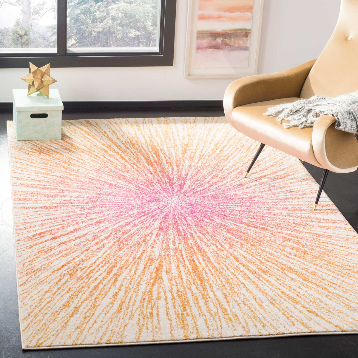 A fuchsia and coral starburst rug brings vivid color to a seating area with a tan chair.